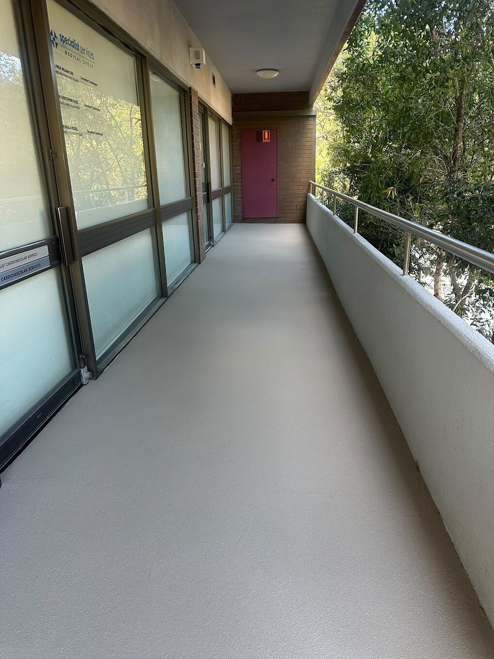 Resurfaced walkway at The Ashley Medical Centre Westmead in Stone acrylic finish