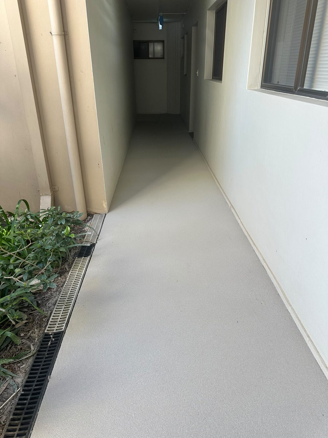 Repaired and resurfaced pebblecrete corridor at a Marsfield retirement village with P5 anti-slip finish