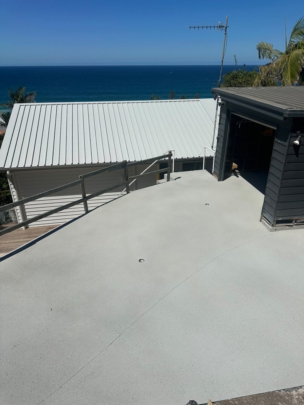 Whale Beach driveway after concrete resurfacing in stone colour with P5 anti-slip finish