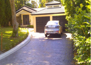 A car parked in front of a garage 