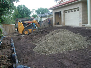a pile of gravel next to a house