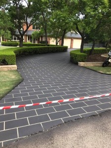 a brick walkway with red and white tape