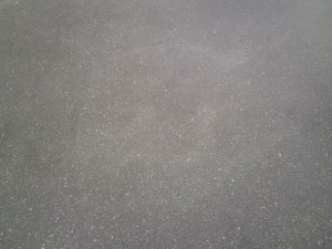 a grey surface with small dots